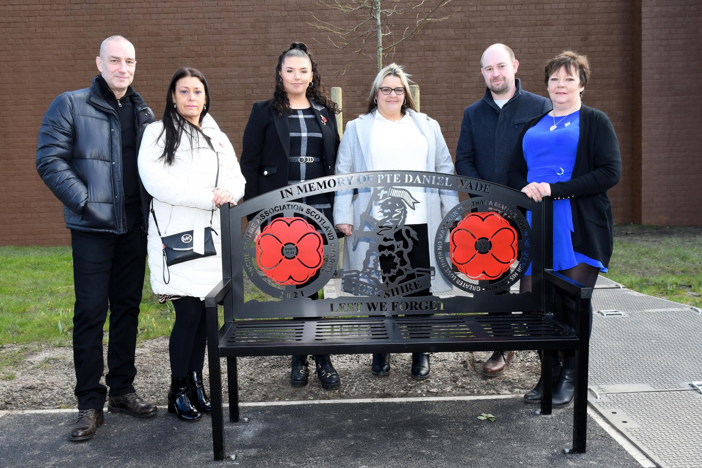 Lisa Billing and her family at the bench in tribute to Pte Daniel Wade at Marshall Gardens