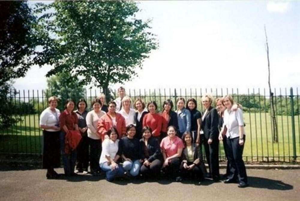 The original 13 nurses and the staff who supported them on their arrival at Warrington and Halton hospitals in 2002