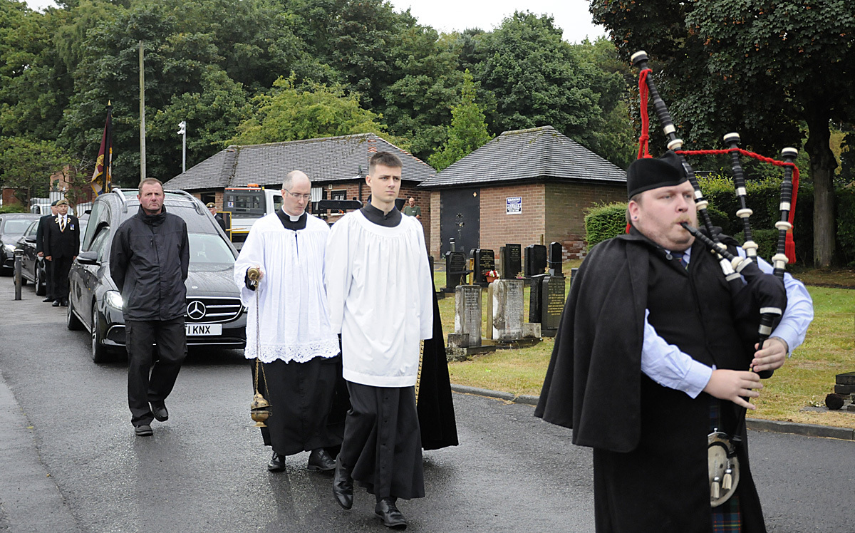 A bagpiper led the hears to Fox Covert Cemetery