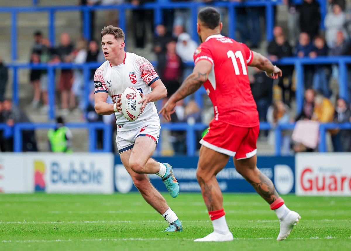 Tonga's Will Penisini (left) and Cook Islands' Kayal Iro in action