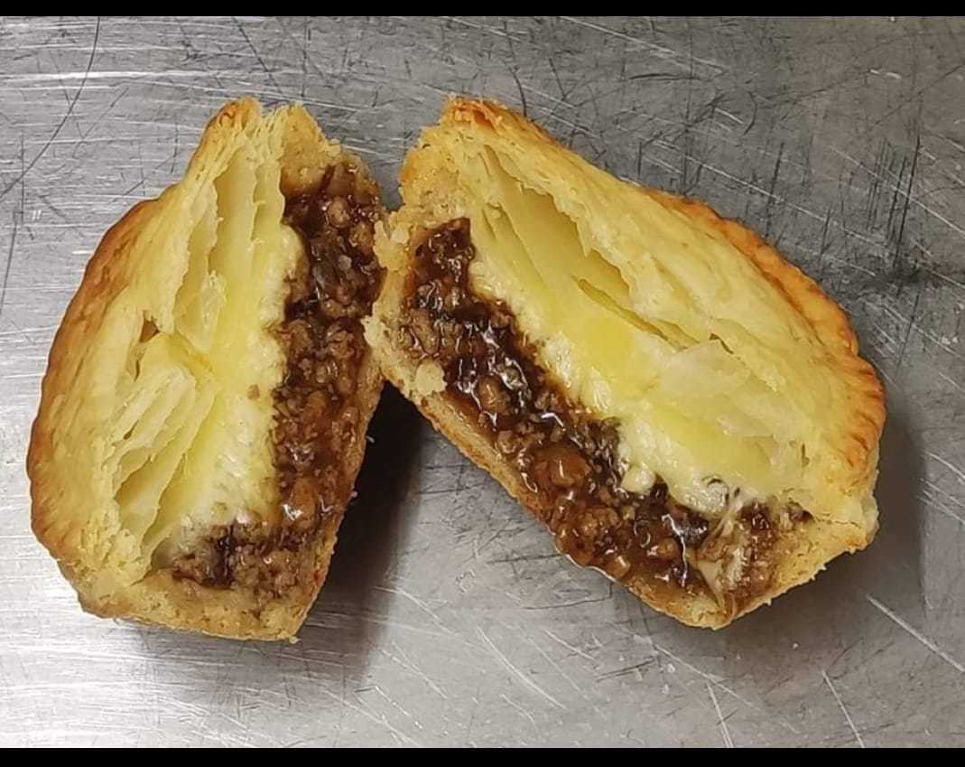 Kiwi mince and cheese pie with a puffed pastry lid