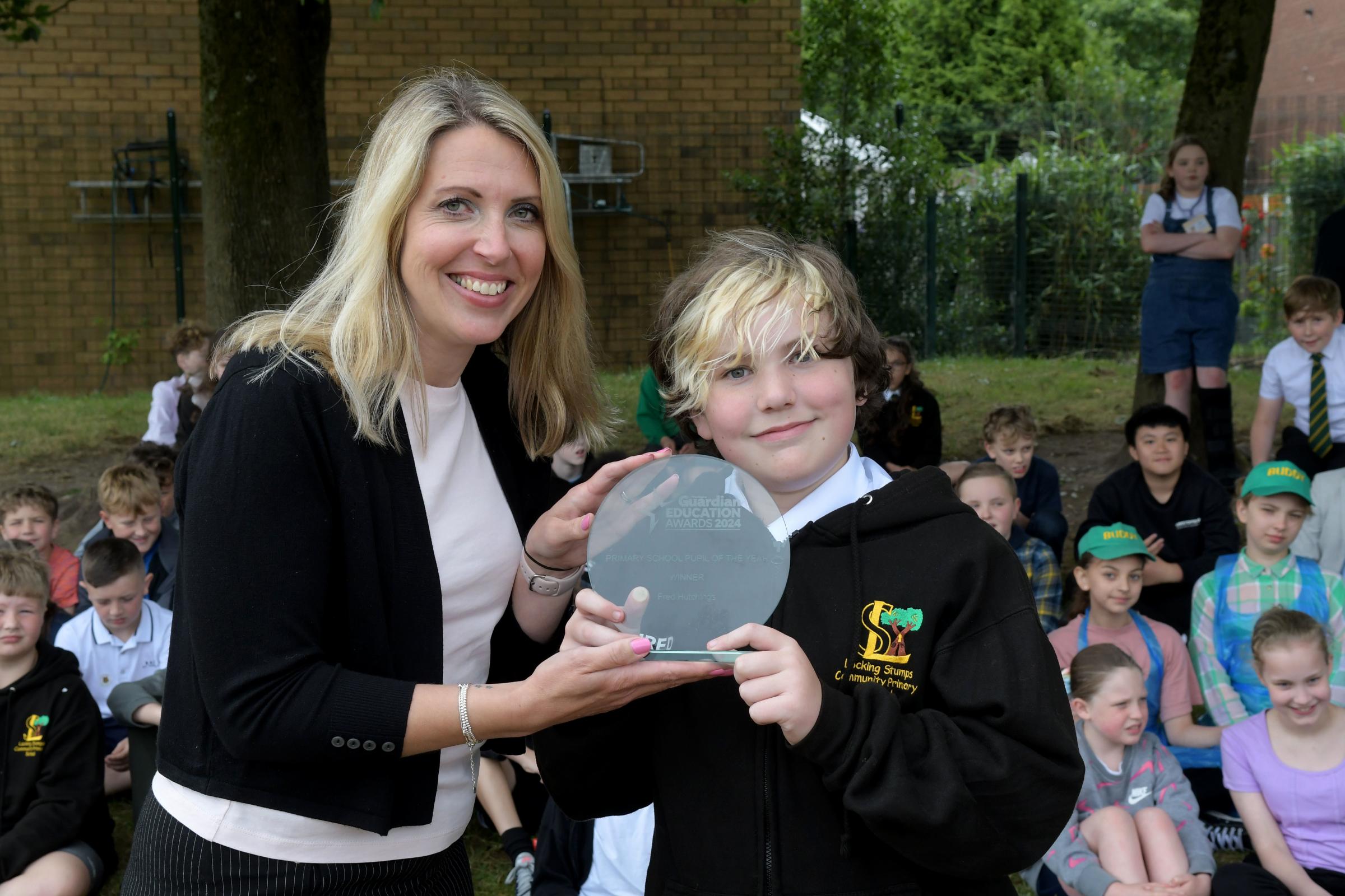 Primary School Pupil of the Year Fred Hutchings and the Warrington Guardians Heidi Summerfield