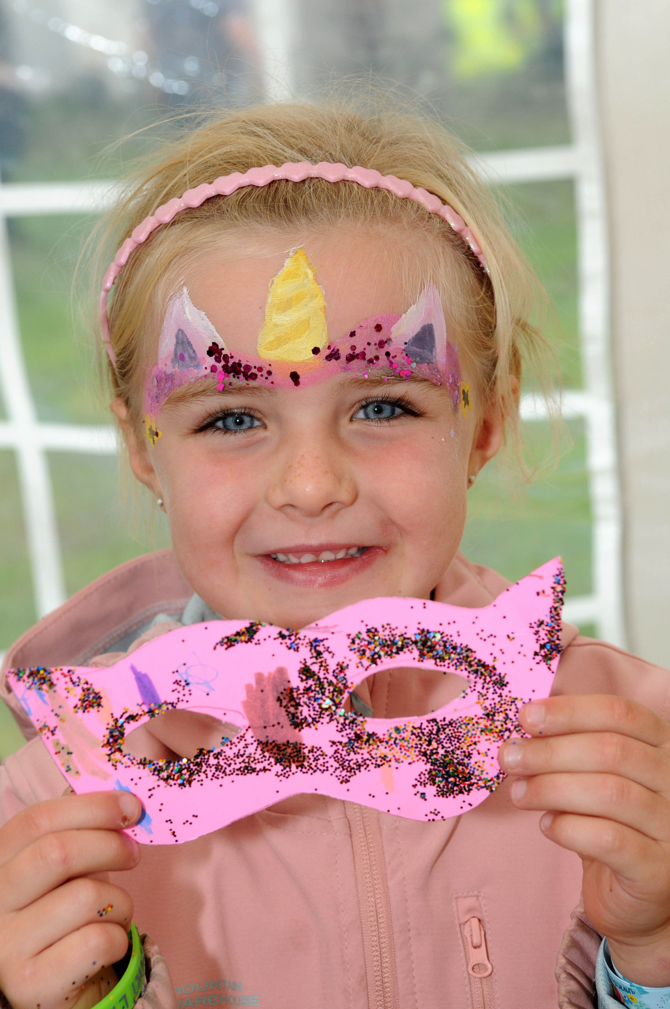 Amelie Mole enjoys having her face painted at DAD