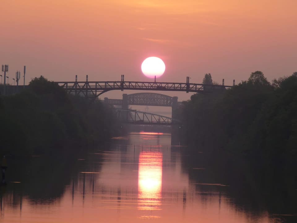 Reflections at sunrise in Stockton Heath by David Noble