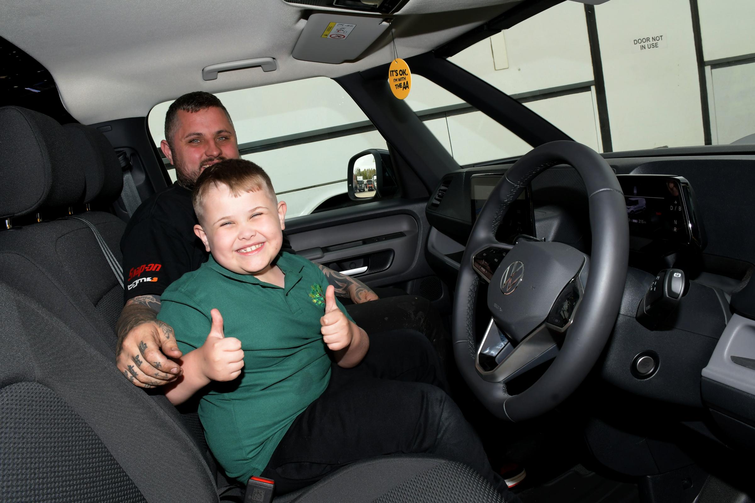 Charlie Hinton in one of the new AA vehicles with his dad Matthew. Picture: Dave Gillespie