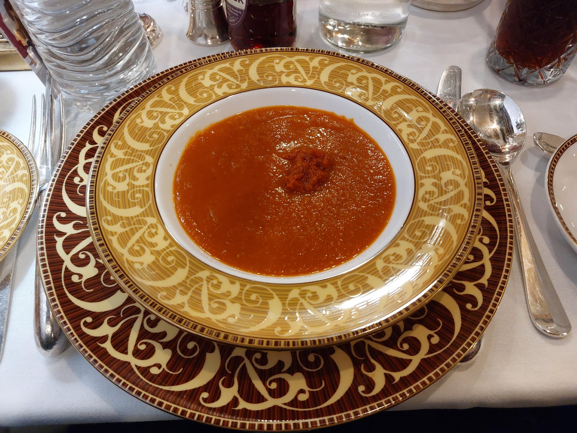 Roasted plum tomato soup with red pepper pesto.