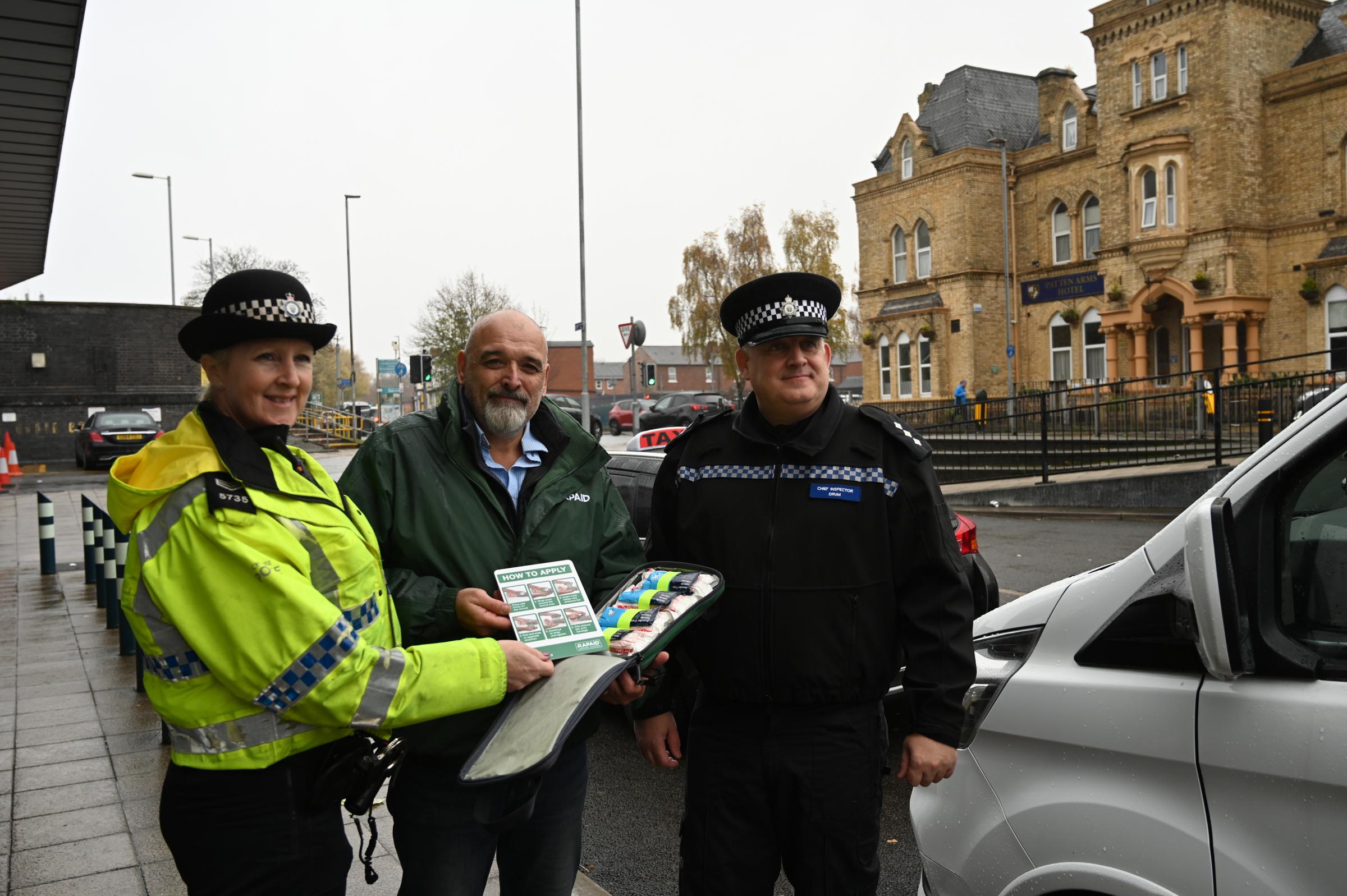 Warrington officer PC Barber with Alex and Neil at Bank Quay